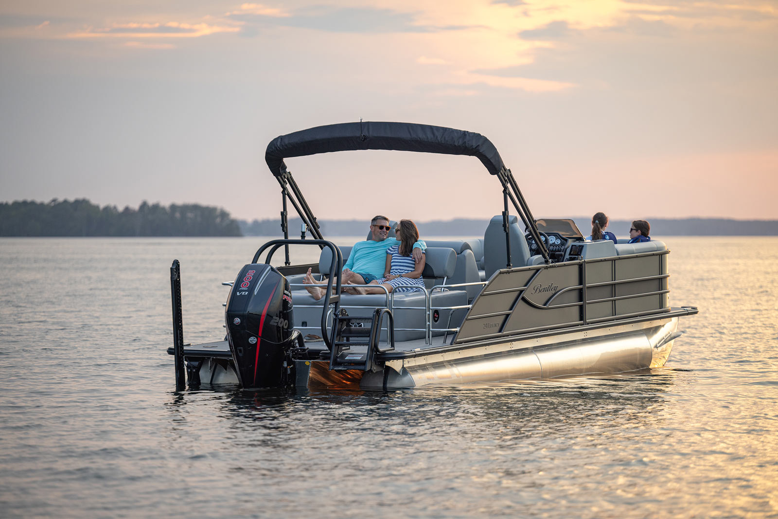 Bentley pontoon boat anchored at sunset